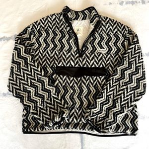 Great condition. Rip curl black and cream fuzzy 1/4 zip jacket. Pouch pocket!